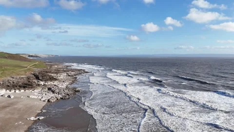 Drone Tracking Toward Waves and Sea Over Coastline, Wales UK 4K Stock-Footage 334067183
