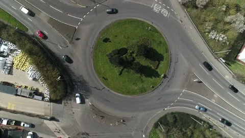 Drone Tracking Van Driving Round a Roundabout Stock Footage 159213314