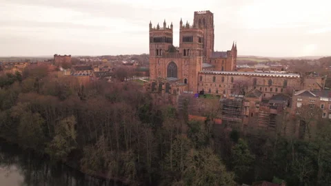 Drone tracks around and rises by Durham Cathedral Stock Footage 242490175