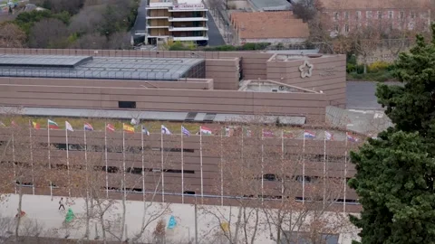 Drone Tracks Left Along Montpellier International Flag Display Video stock 344444840