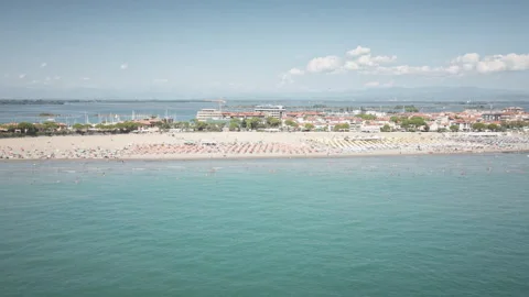 Drone tracks right over Grado island beach and lagoon 4K Video stock 331382898