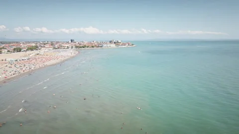 Drone tracks right over Grado beach and Adriatic coastline 4K Video stock 331384106