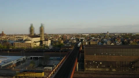 Drone Tracks Subway Train from Above during Sunrise/Sunset in Pilsen Stock Footage 132741940
