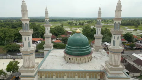 Drone Tracks Through Mosque Minarets And Dome To Rice Fields Madura Island Stock Footage 337980314