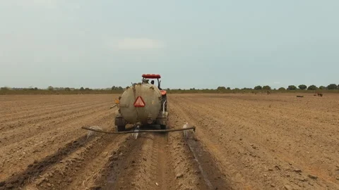 DRONE ON TRACTOR FARMING Stock Footage 306694774
