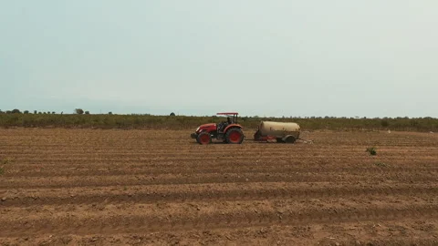 DRONE ON TRACTOR FARMING Stock Footage 306694867