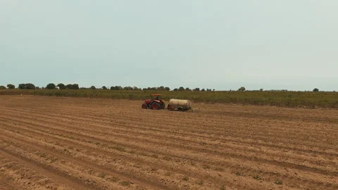 DRONE ON TRACTOR FARMING Stock Footage 306694903