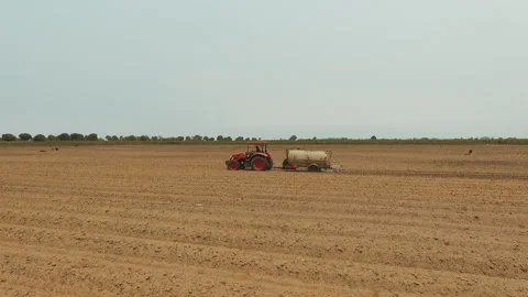 DRONE ON TRACTOR FARMING Stock Footage 306694952