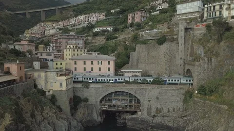 Drone | Train Passing Through Town | Italia Coast (No Color Grade) Stock Footage 106795686