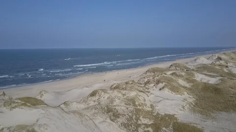 Drone travel along North Sea beach in wind Stock Footage