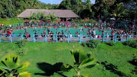 Drone travel over a public pool  in Central America Stock Footage 101313904