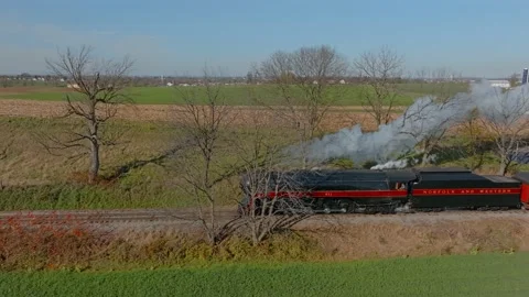 Drone Traveling Parallel View of a Steam Passenger Train Blowing Lots of Sm.. Stock-Footage 230115905