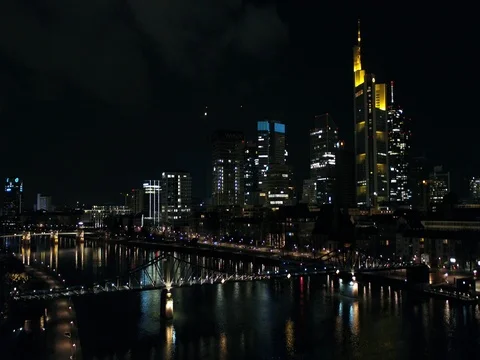 Drone trip above the river in spring at night, Frankfurt, skyline, aerial. Video stock 80188824