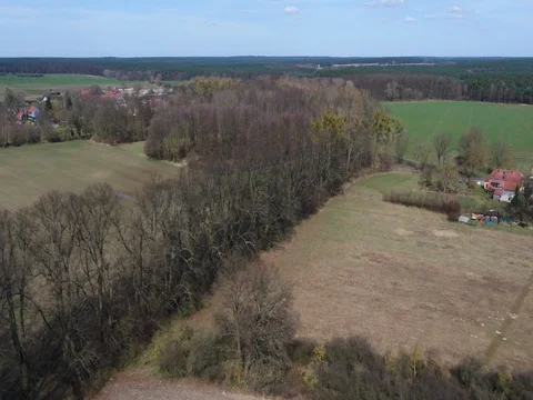 Drone trip above rural landscape in spring at daytime, Zernikow, aerial. Video stock 80417588
