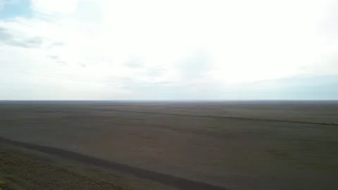 Drone turn from river revealing vast Kazakh steppe Stock Footage 334325810