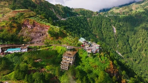 Drone Turning Left Above Halsema Highroad Point With Clouds Over Mountain Slopes Stock Footage 344438561