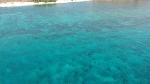 Drone, turquoise ocean, beach and small island, Komodo Indonesia Stock Footage 131437229