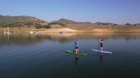 Drone of two stand up paddle boarders on reservoir near Park City, Utah. Stock Footage 47232678