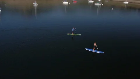 Drone of two stand up paddle boarders at Jordanelle State Park reservoir, Utah. Stock Footage 98009649