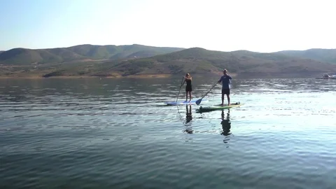 Drone of two stand up paddle boarders near Park City, Utah. Stock Footage 98009712