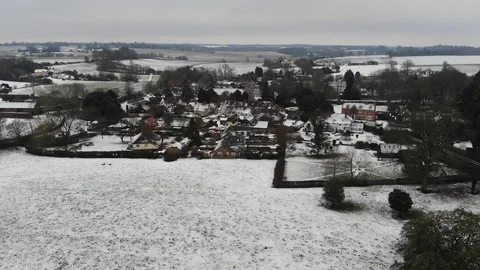 DRONE UK Essex Snow Winter Village Church Rural Stock Footage