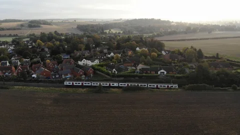 Drone UK Panning shot Train through countryside Stockbeeldmateriaal 118135757