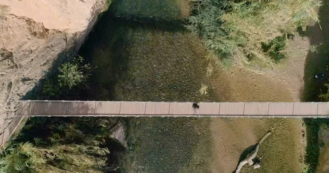 Drone vertical ascent over bridge in deep cliff Stock Footage 124387997