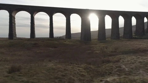 Drone Viaduct with sun beaming through arches, Ribblehead, Yorkshire 60fps Stock-Footage 88954892