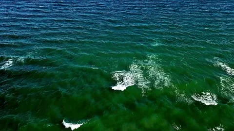 A drone video from above showing the Baltic Sea with turquoise water in Olp.. Stock Footage 319989824