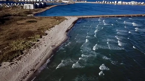 A drone video from above showing Weidefelder Beach and the Olpenitz pier Stock Footage 319965288