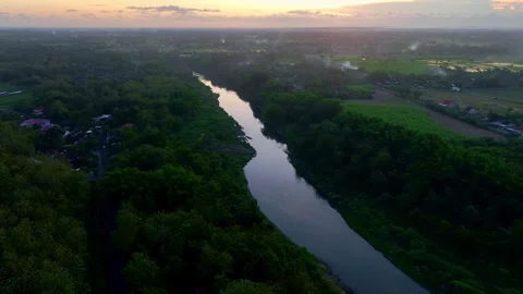 Drone video above sunset river and countryside Stock Footage 336315407