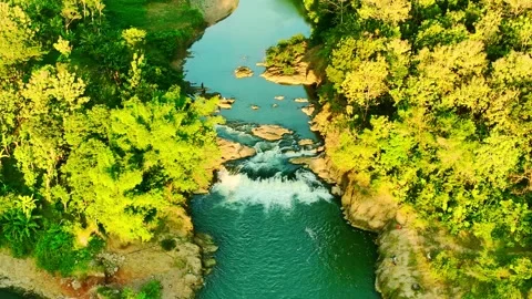 Drone video above turquoise river rapids and forest Stock Footage 336314894