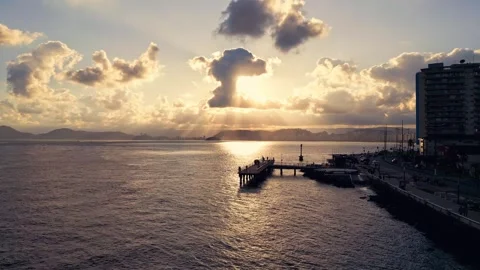 Drone video approaching a fishing deck in a beautiful sunset. Video stock 244949688
