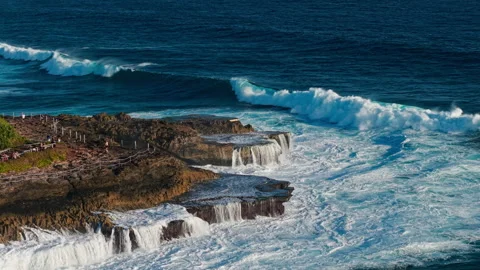 Drone video of big waves crashing at Devils Tears, dream beach a popular tourist Stock Footage 316656837