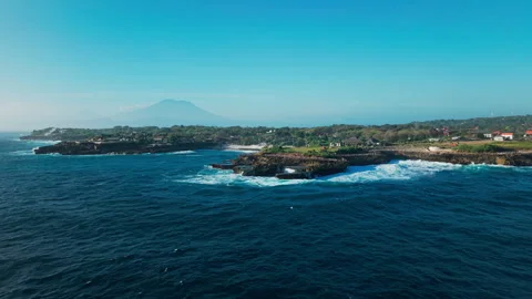 Drone video of big waves crashing at Devils Tears, dream beach with Mount Agung Stock Footage 316656925