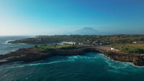 Drone video of big waves crashing at Devils Tears, dream beach with Mount Agung Stock Footage 316656959