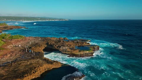 Drone video of big waves crashing at Devils Tears, dream beach a popular tourist Stock Footage 316657495
