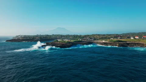 Drone video of big waves crashing at Devils Tears, dream beach with Mount Agung Stock Footage 316657572