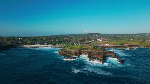 Drone video of big waves crashing at Devils Tears, dream beach a popular tourist Stock Footage 316657893