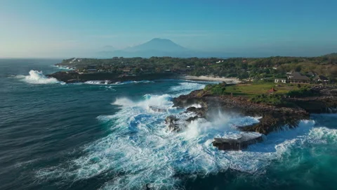 Drone video of big waves crashing at Devils Tears, dream beach with Mount Agung Stock Footage 316657973