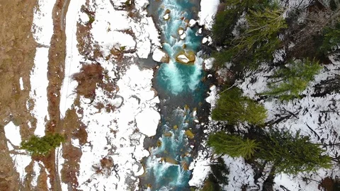 Drone video of  blue river stream in snowy valley. Stock Footage 110166860