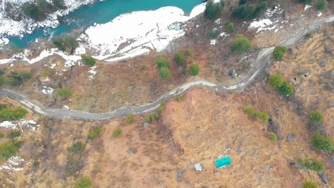 Drone video of  blue river stream in snowy valley. Stock Footage 110167277