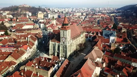 Drone video of Brasov Black Church on a sunny day. Brasov beautiful old town and Stock Footage