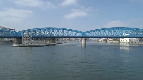Drone video of the Cairo Imbaba Bridge, crossing under the bridge, a fishing boa Stock Footage 175626562