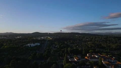 Drone video capturing Canberra's cityscape with a view of Parliament House, lush Stock Footage 333798197
