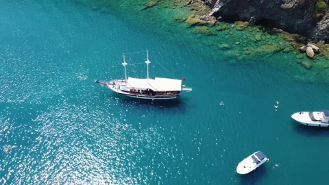 Drone video capturing the pristine beatch rock, Fethiye, featuring its tranqu 스톡 동영상 280791097