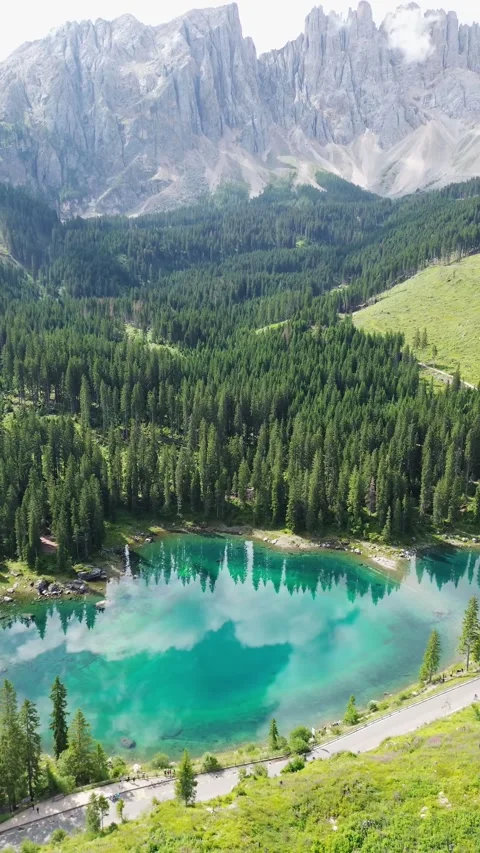 Drone video Carezza lake Dolomites Italy europe Stock Footage 302584965
