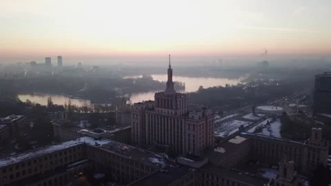 Drone Video of Casa Presei Libere in Bucharest at sunrise with Herastrau Lake Stockbeeldmateriaal 149395904