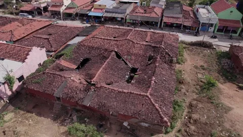 A drone video of collapsed traditional tiled old indian house roof showing .. Stock Footage 346712159