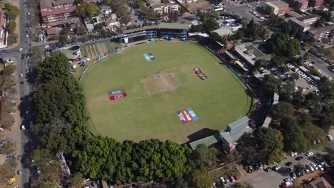 Drone video of a cricket match between Zimbabwe and Sri Lanka at Queens Stock Footage 245710066